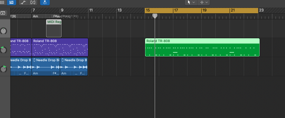 Close-up of the arrangement: purple and green Roland TR-808 regions and blue bass loop regions